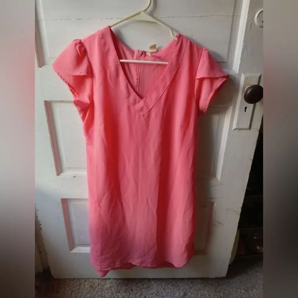 T-Shirt style poly zip-back bold salmon colored summer dress.